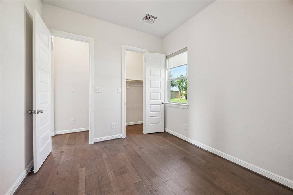 Added as an upgrade, this perfectly positioned guest bedroom located on the first floor of the home offers a great experience for your guest or family member.   Fitted with its own private ensuite bath and upgraded stand-up shower.  A quaint window allows just the perfect amount of light into this darling space.