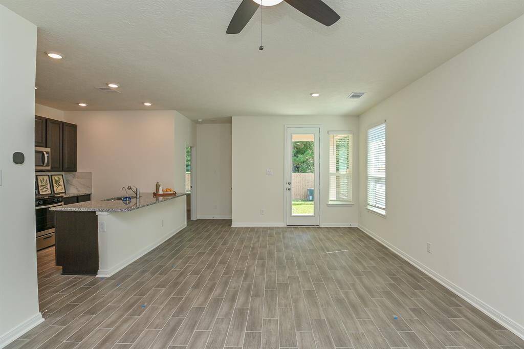 9 FOOT HIGH CEILING MAKES THE SPACE LOOK BIGGER! ALLERGY-FREE GREY TILE FLOORING THROUGHT LIVING ROOM, DINING, KITHCN, & STUDY
