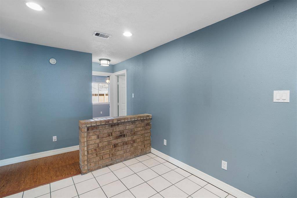 Brick accent ledge off the kitchen is a great spot for breakfast area