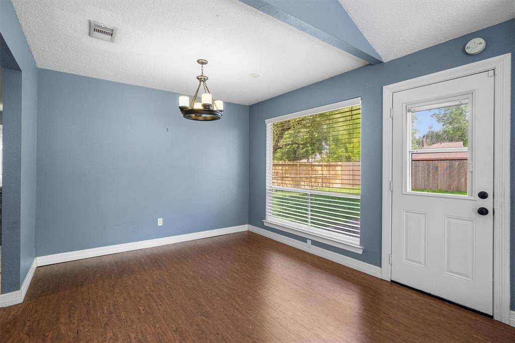Dining room space with floor to ceiling window overlooking your back yard