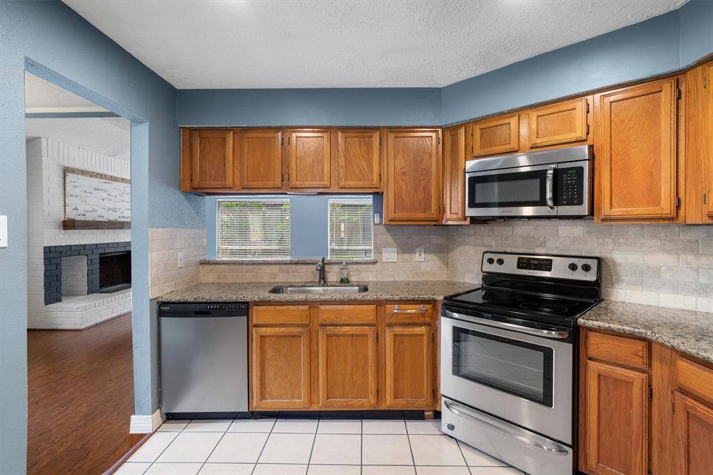 Adorable kitchen! Plenty of storage and counter space.