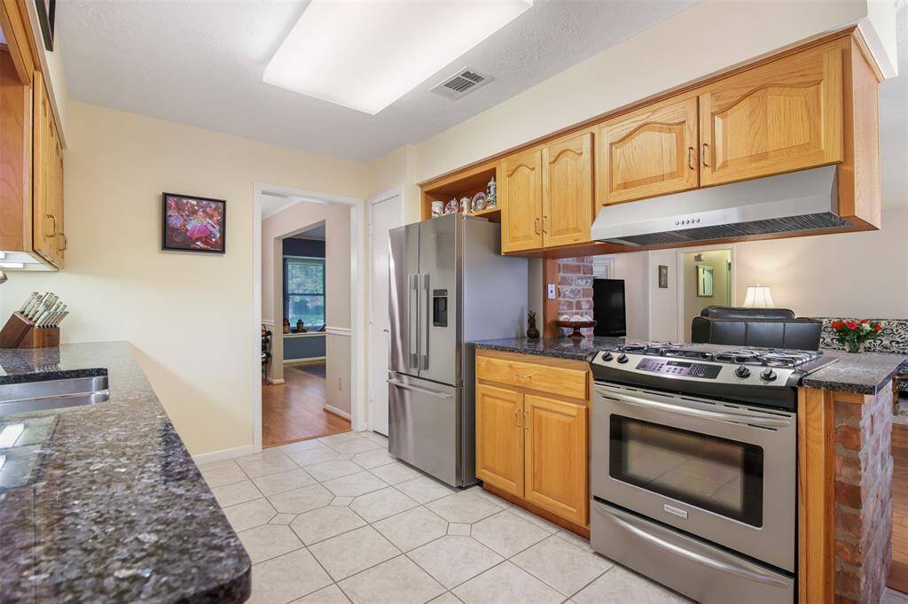 The kitchen is open to the family room and perfect for the cook of the family with a Frigidaire gas range.