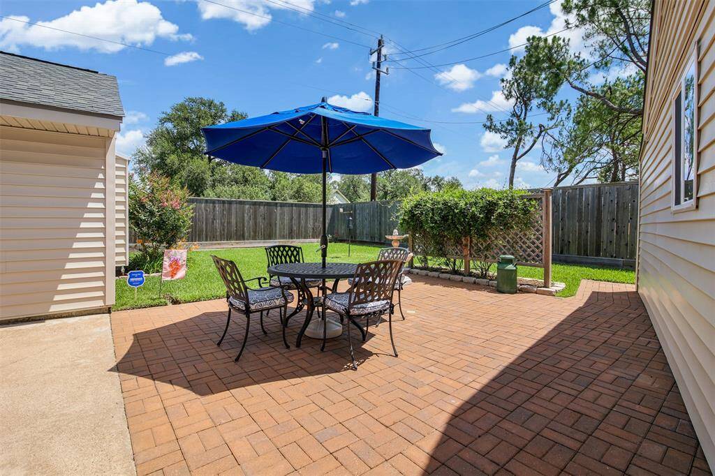 Backyard has generously sized brick patio perfect for entertaining.