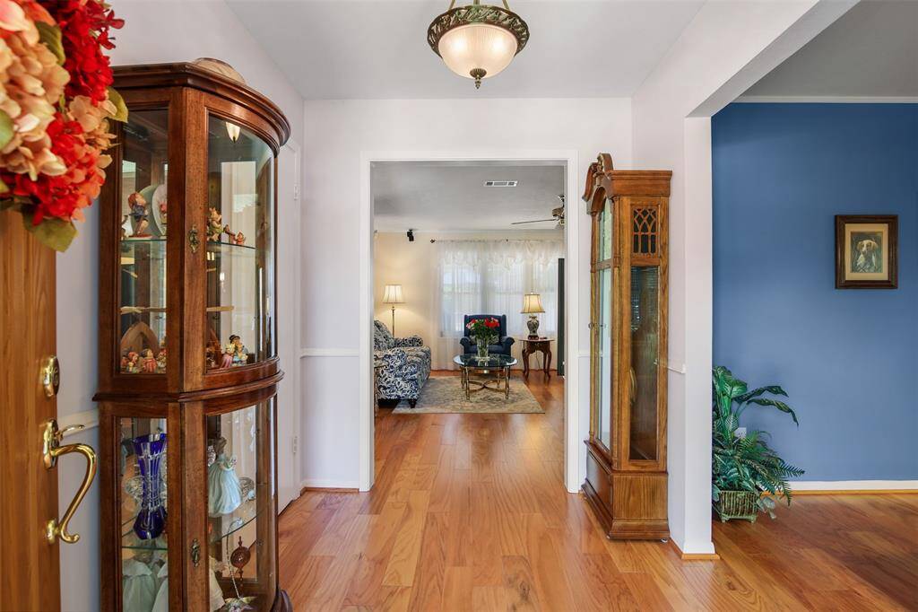 Another view of the front entry opens up to the living room and family room.