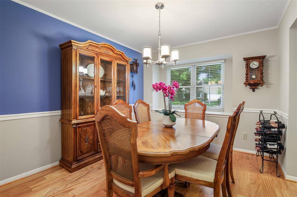 The dining room is just off the kitchen and has a picture window over looking the front yard.