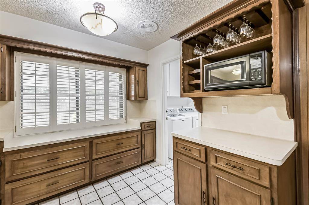 dry bar and entry to laundry room