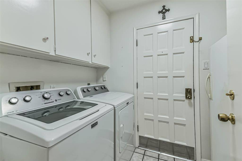 laundry room with exit to covered back patio and breezeway to garage