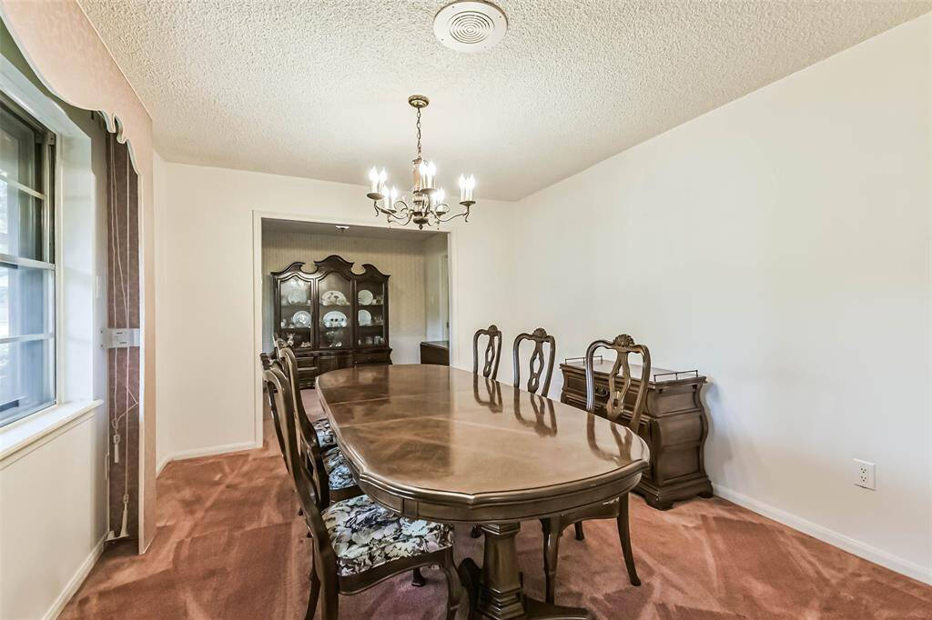 dining room with view into breakfast room