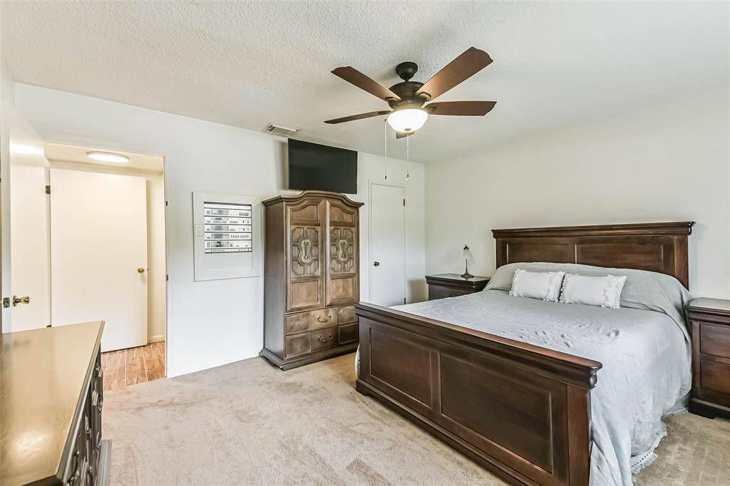 primary bedroom with walkin closet (and built in stereo system)