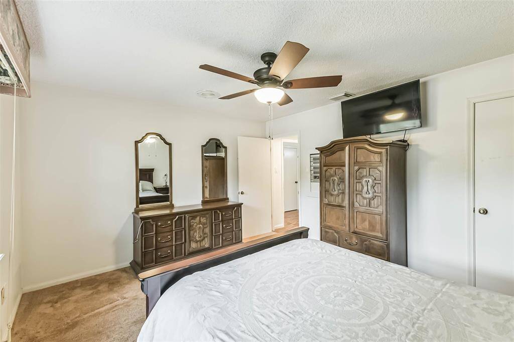 primary bedroom with view to entryway