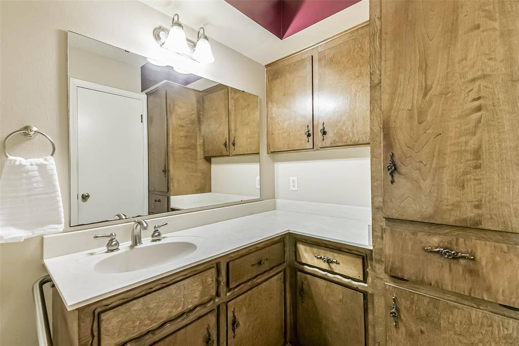 primary bathroom with built in clothes hamper