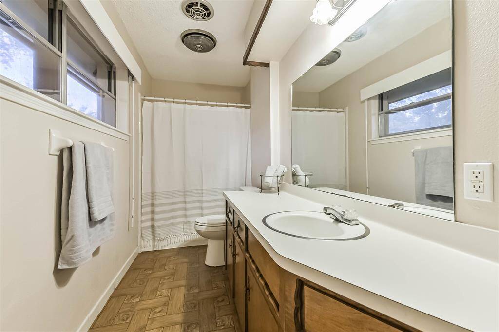 shared bathroom upstairs with tub/shower combo