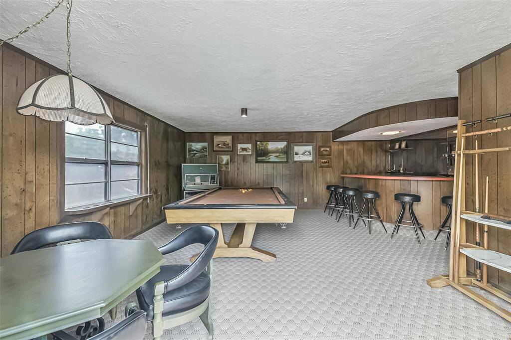 take a step back in time with this furnished gameroom.