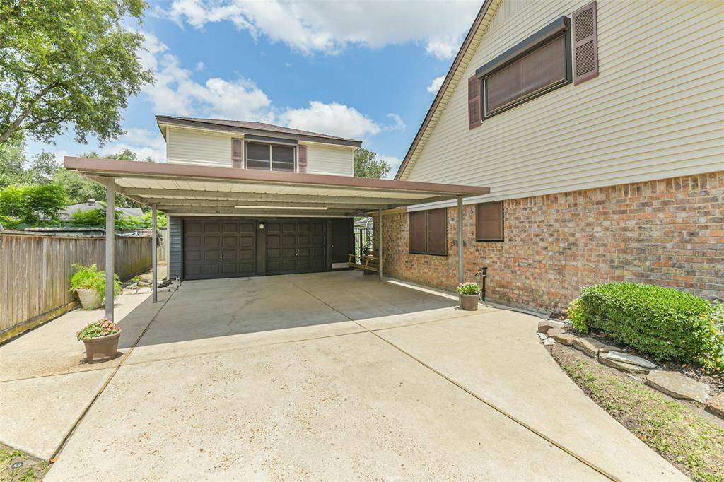 2 car garage with additional 2 car covered patio. gameroom above garage