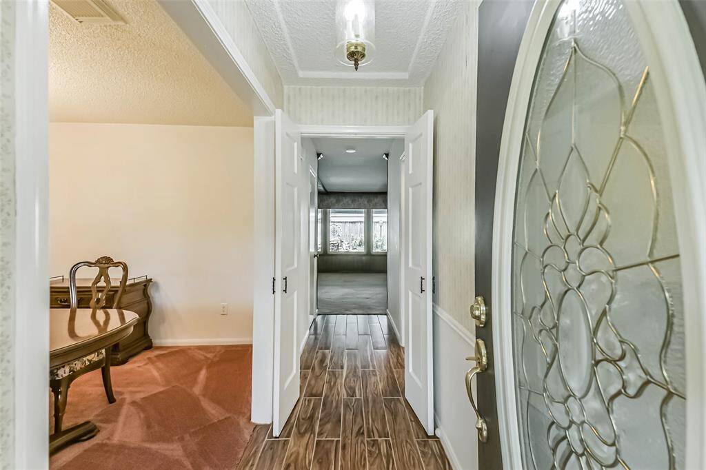entry into home. dining to the left with view to living room straight ahead