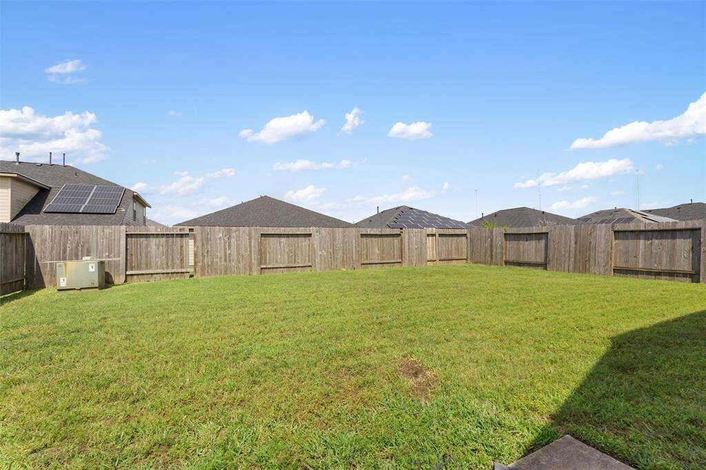 Spacious fully fenced backyard with a large grassy area. Great for outdoor entertaining. Enjoy privacy and plenty of room to customize your ideal outdoor retreat.