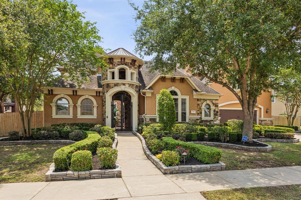 Marvel at this gorgeous semi-custom-built home with Lush Landscaping and curb appeal aplenty in the exclusive Avalon at Telfair.