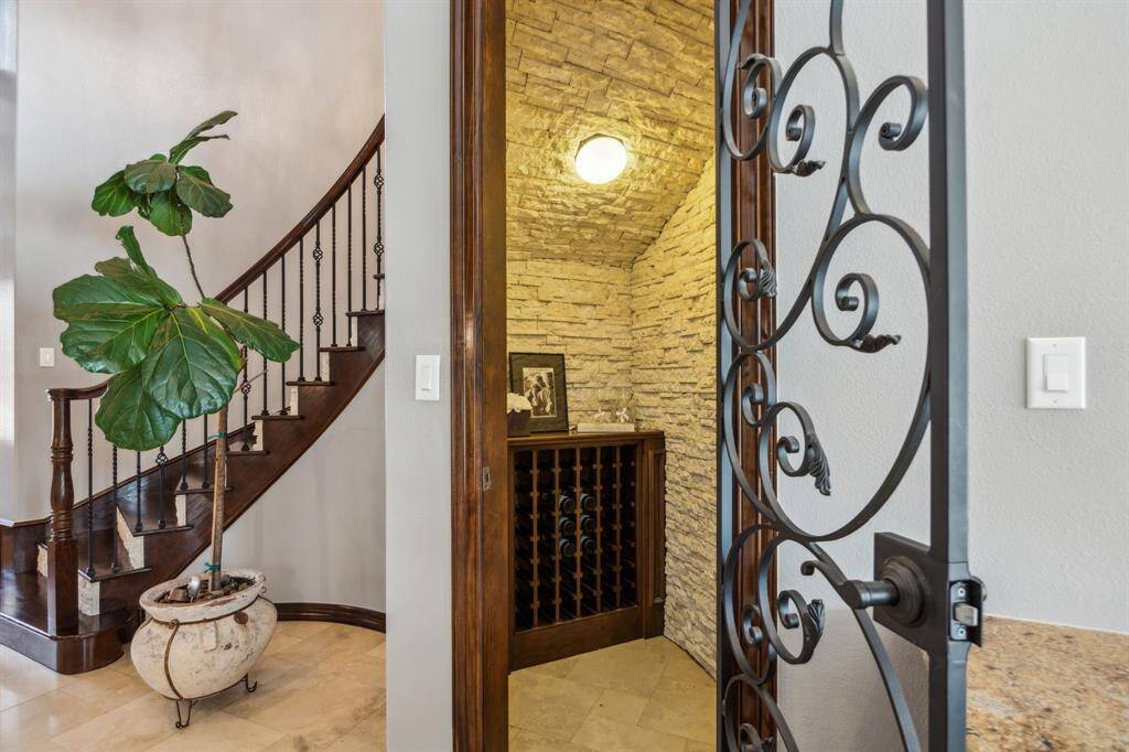 Wine enthusiasts, take note! This custom-built wine nook is a true gem, featuring wine coolers, mini refrigerator for optimal temperature-controlled storage. The upgraded granite countertops add a touch of luxury, while upper and lower cabinetry provide ample space for all your essentials. A perfect blend of style and function, cheers to refined living!