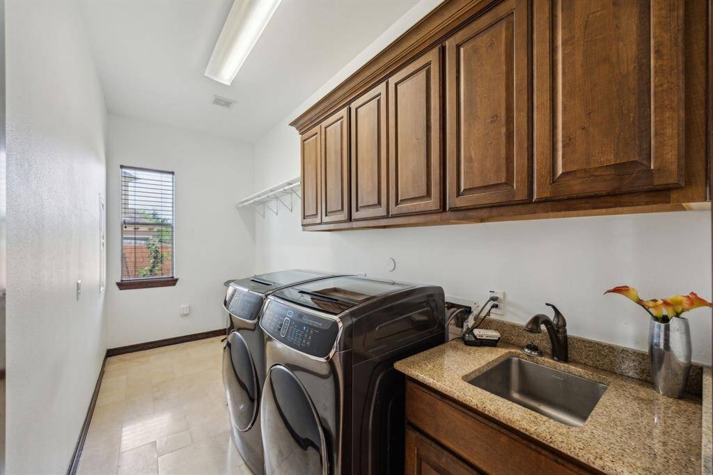 The Enormous walk-in Pantry is designed perfectly! Nothing missed in this home!