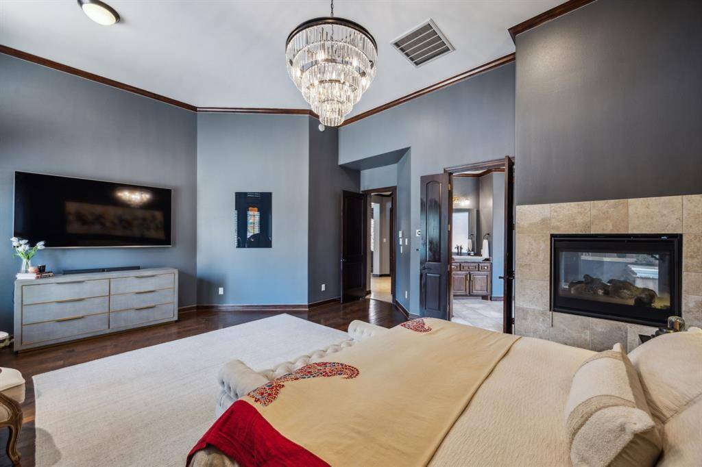 This elegant Primary Bedroom is your ultimate retreat, featuring serene views, abundant natural light, and classic wooden accents that evoke timeless charm. Imagine waking up in this exquisite, cozy space every day!