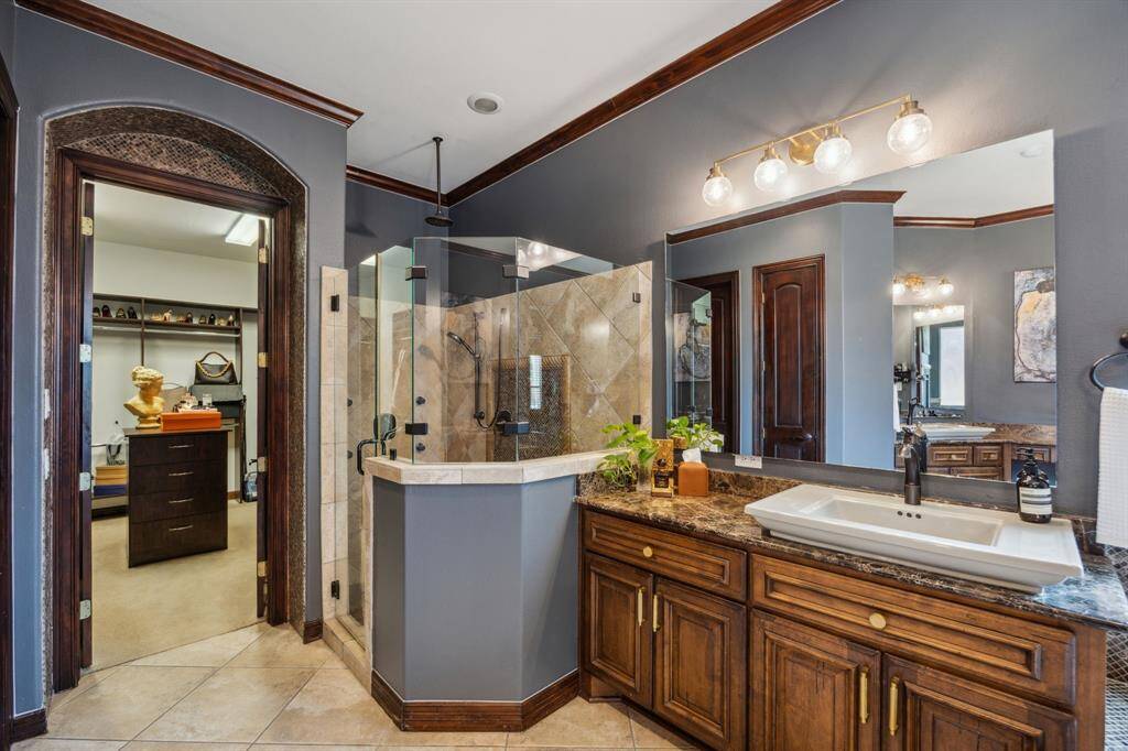 Step into your spa-like oasis in this stunning primary bathroom, featuring luxurious finishes, a spacious walk-in shower, and a soaking tub perfect for unwinding.