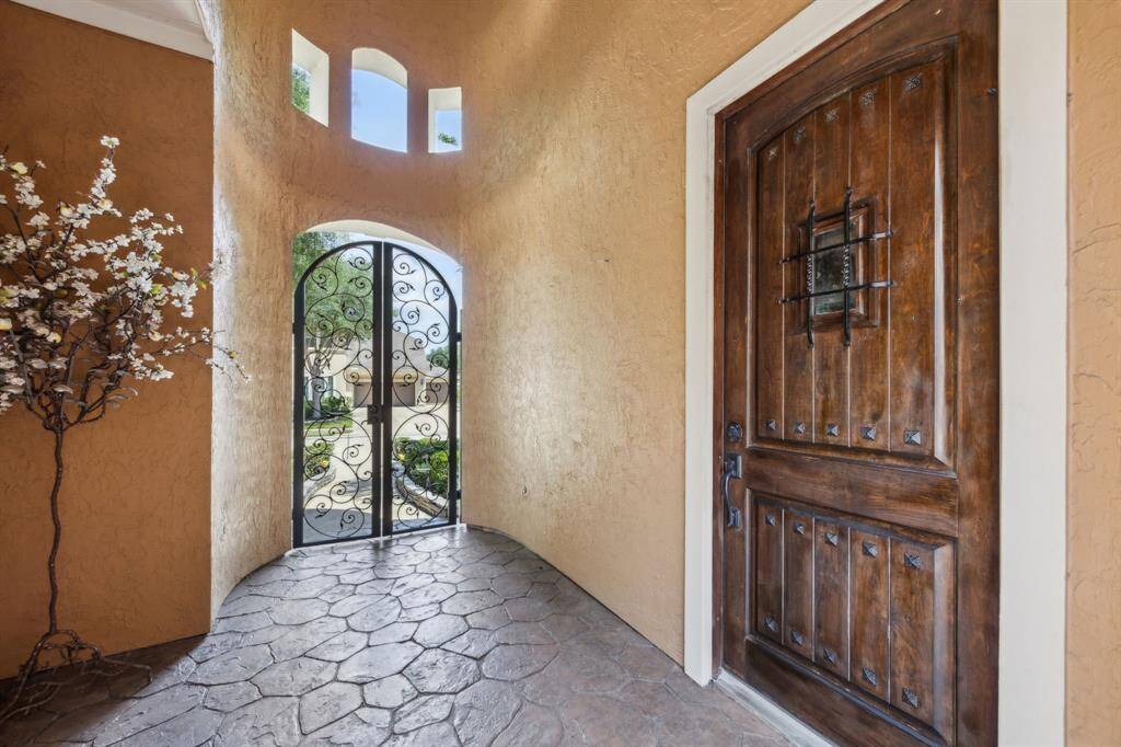 Notice the Paver Walkway leading to the welcoming Front Doors. Also, notice the private entrance to the second room downstairs.