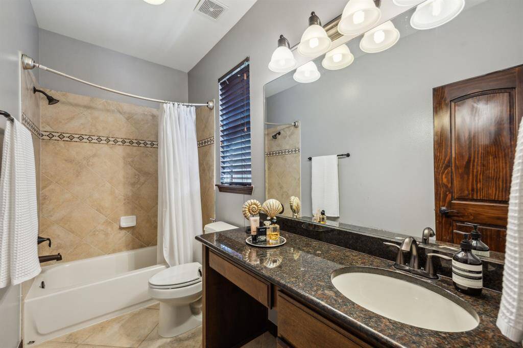 Step into serenity with this beautifully appointed Third Bedroom, offering a tranquil ambiance complete with elegant millwork and charming accents. Your guests will wake up to serene retreat that is as upscale as the other rooms of the home.