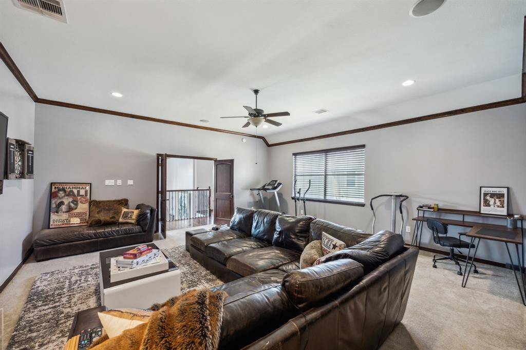 The fifth bedroom offers generous space and comfort, featuring its own private en suite bathroom and a sizable walk-in closet. Whether used as a guest suite, teen retreat, or additional family bedroom, this well-appointed space provides both privacy and functionality.