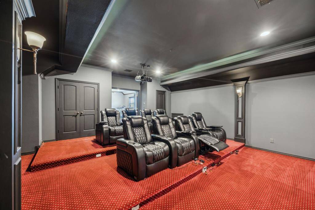 This expansive game room offers endless possibilities for entertainment and relaxation, with ample space for a pool table, lounge seating, or even a play area. Its open layout fosters a fun, social atmosphere and seamlessly connects to the media room, perfect for movie nights, game days, or hosting family and friends in style. A true hub for making memories.