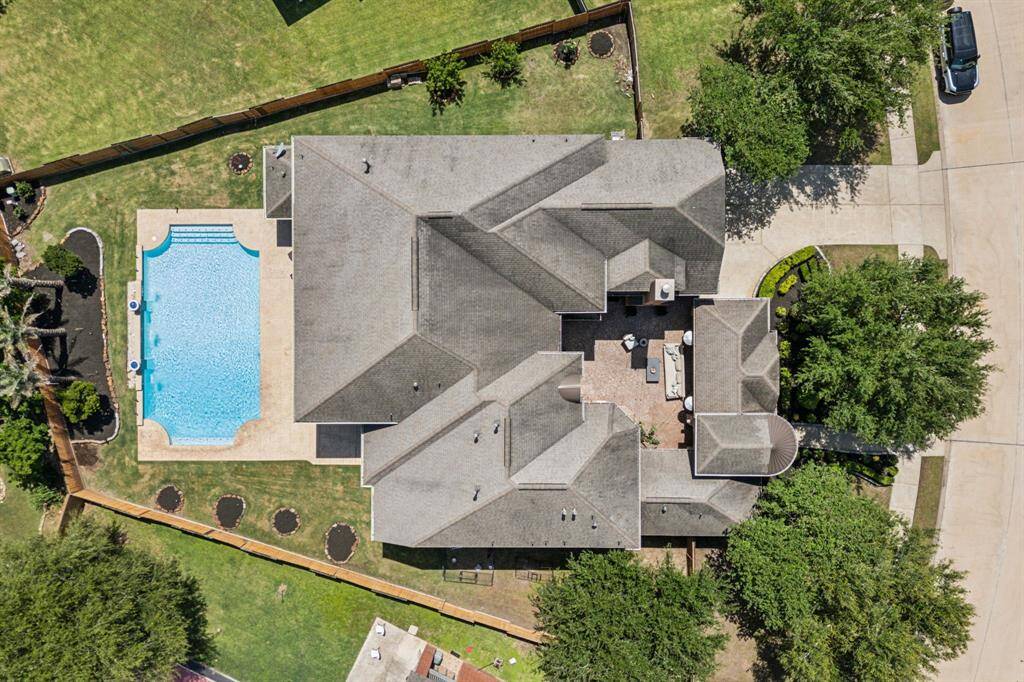 As twilight sets in, the pool area transforms into a serene and sophisticated retreat. Soft lighting reflects off the water’s surface, creating a tranquil glow that enhances the surrounding landscaping and architectural features.