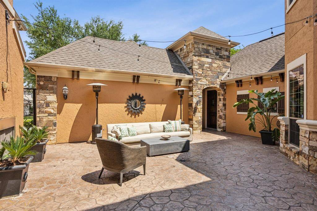 Experience the enchanting ambiance of the courtyard at twilight, where warm lighting, elegant architecture, and open-air charm create the perfect setting for evening gatherings. This beautiful space truly comes to life as the sun sets, making it ideal for entertaining guests or enjoying a peaceful night under the stars.