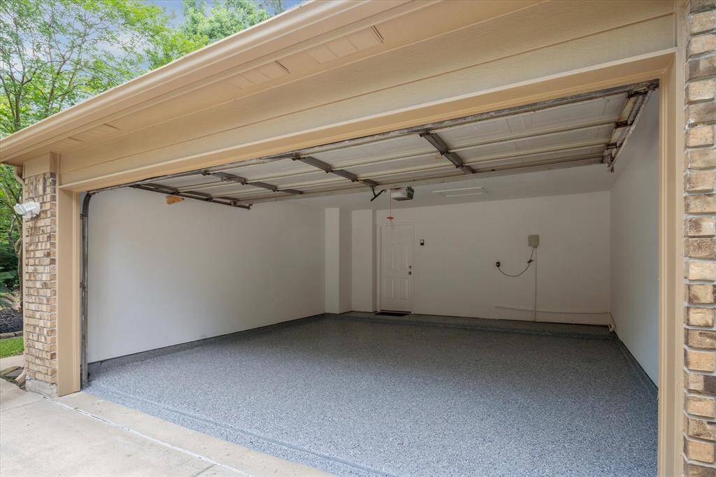 Look at this remodeled garage with Epoxy floors.