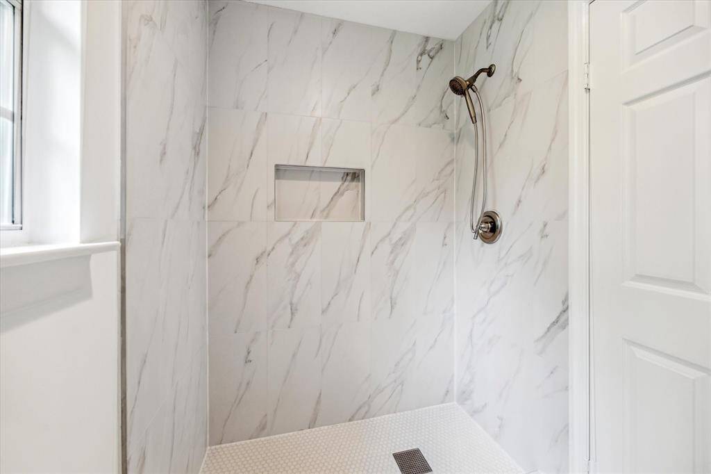 The secondary bathroom new shower.