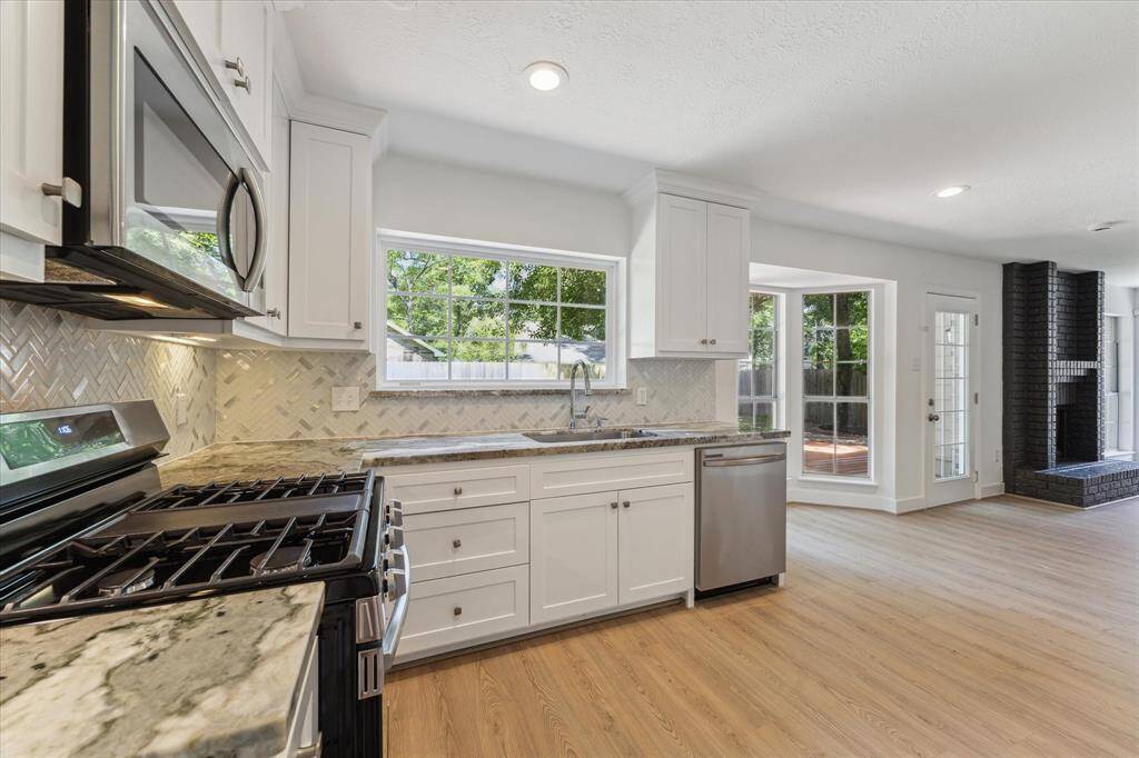 View of this upgraded granite, kitchen cabinets and breakfast area.
