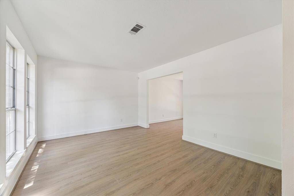As you enter to the left you see the formal areas that could be formal living area or a modern open office.