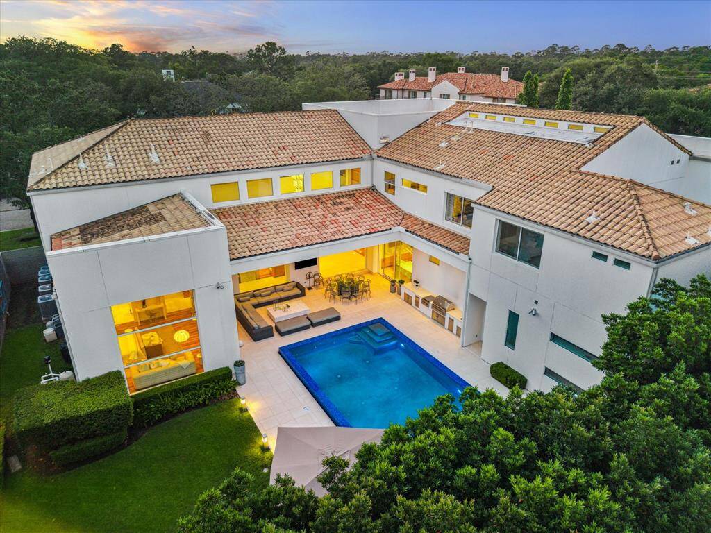 This custom contemporary residence exudes luxury in every detail.