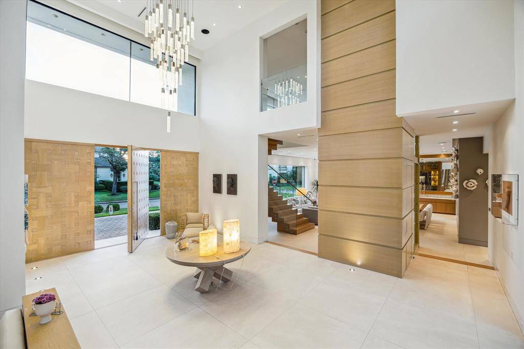 Guests are greeted by a grand formal entry with soaring ceilings, setting the tone for the elegance that awaits.