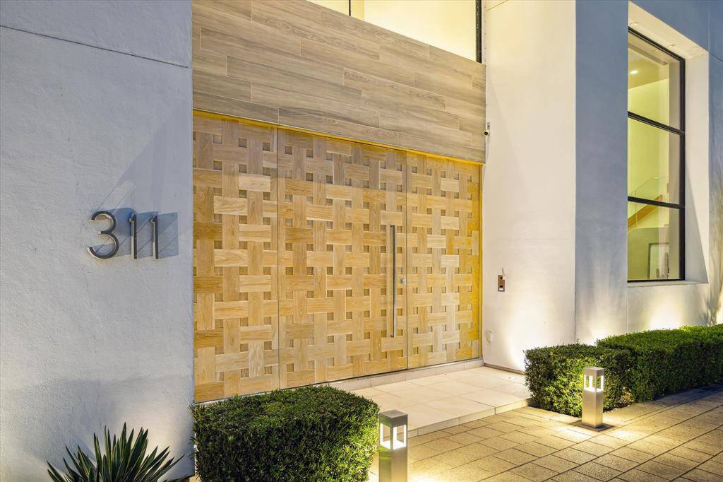 This spectacular property showcases clean architectural lines,  light-filled interiors, and soaring ceilings.