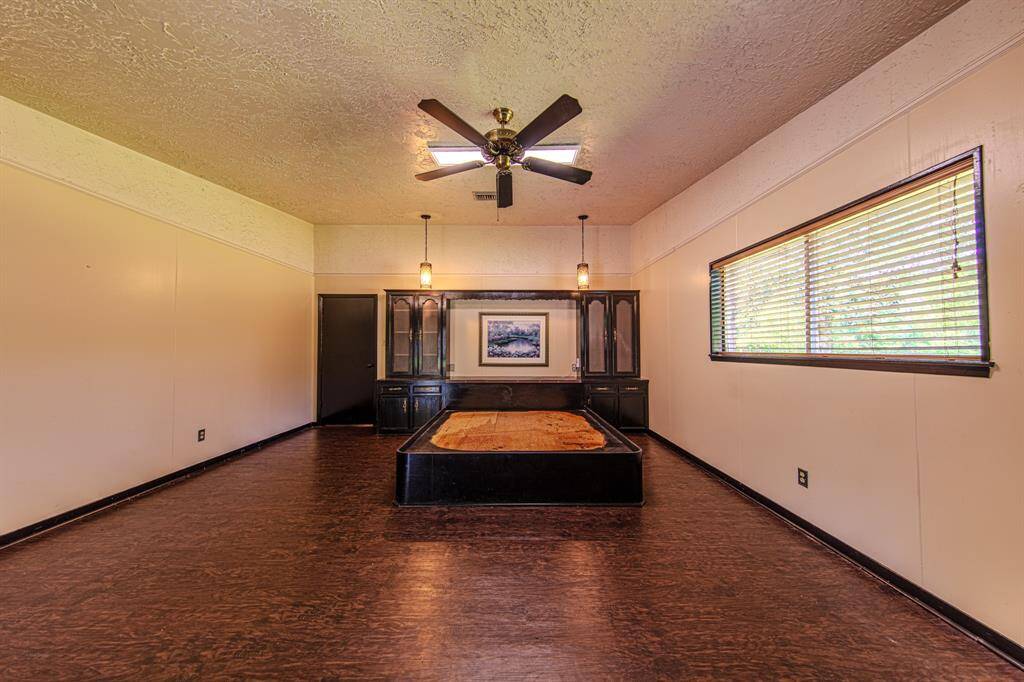 Primary bed and entry to bathroom with access to outside