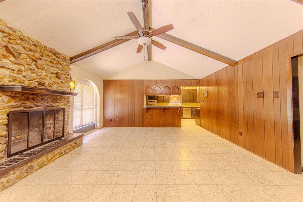 Living room with view into kitchen