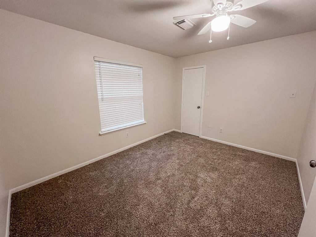 Second bedroom overlooks the backyard and has a large walk-in closet.