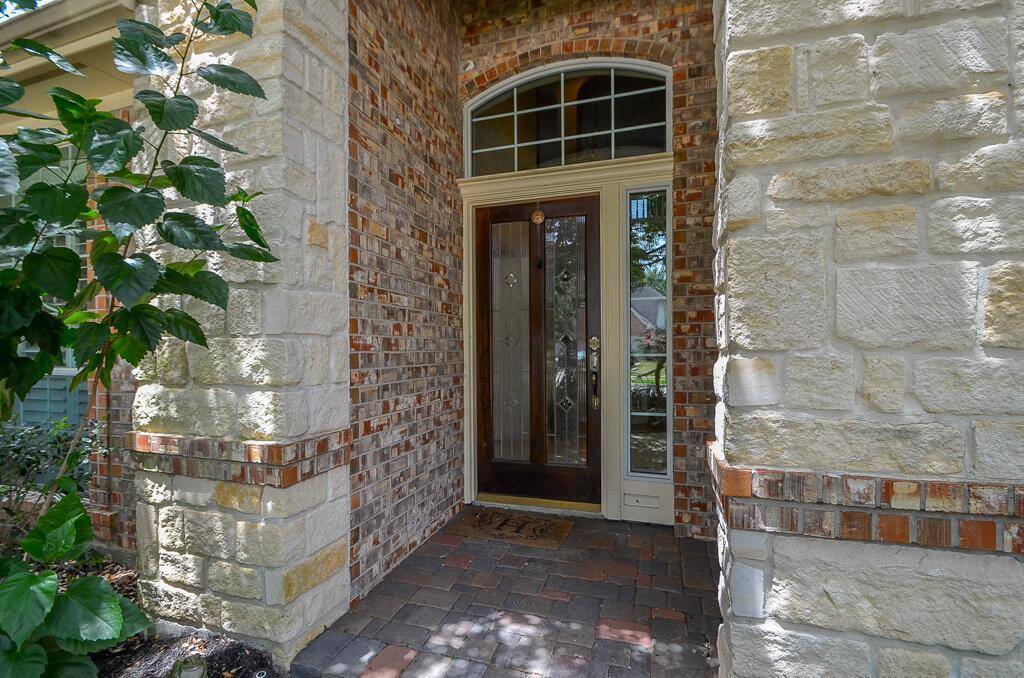 Warm and inviting stone and brick entry to the highly desirable Cinco Ranch Subdivision