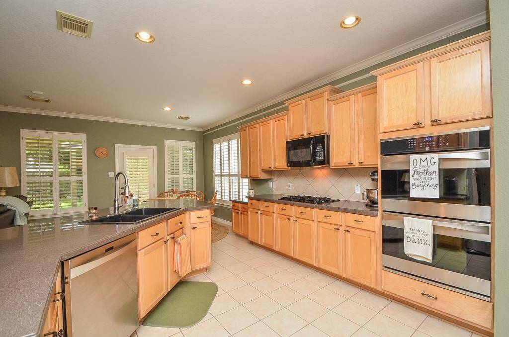 Another view of this Chefs kitchen with double ovens.
