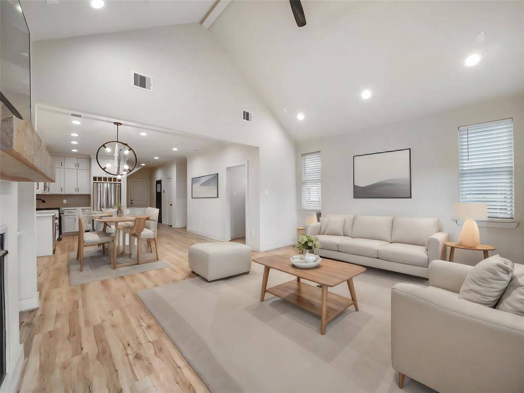 Here is a view from the living room facing into the dining and kitchen area. The office nook is to the right of the photo. Photo is virtually staged.