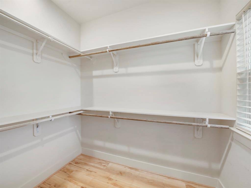 Primary walk-in closet.