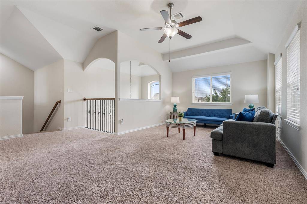 Upstairs, you'll find three generously sized bedrooms, each with ample closet space, sharing access to well-appointed bathrooms.