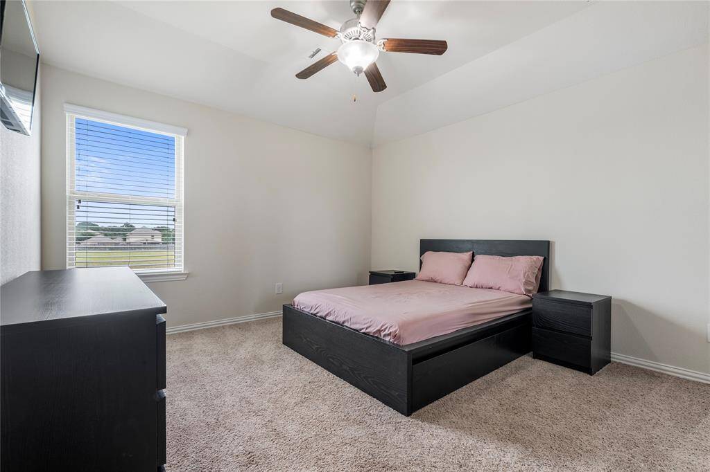 Upstairs, you'll find three generously sized bedrooms, each with ample closet space, sharing access to well-appointed bathrooms.