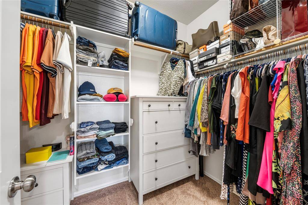 Upstairs, you'll find three generously sized bedrooms, each with ample closet space, sharing access to well-appointed bathrooms.
