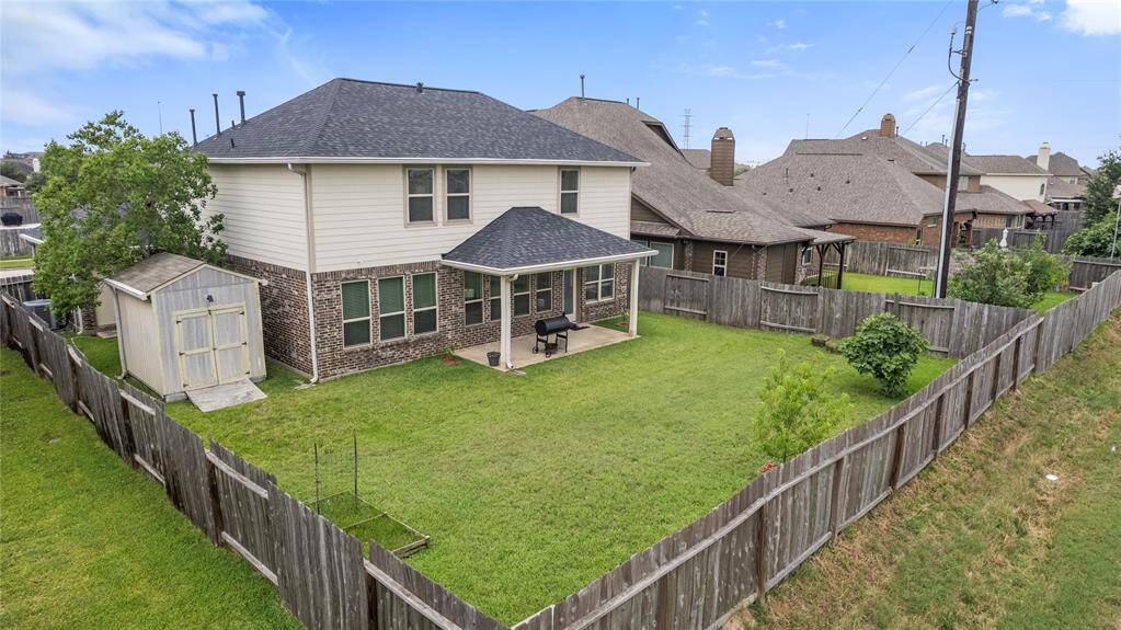 The backyard offers a private outdoor space with no rear neighbors, providing a serene setting for relaxation or outdoor activities.