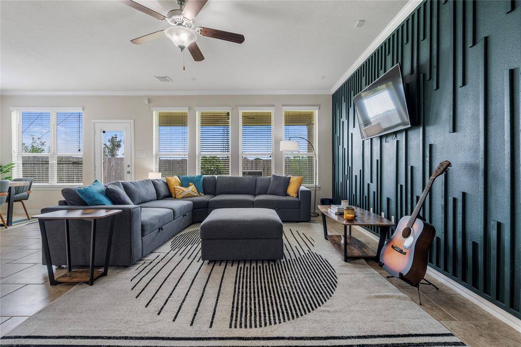 Located on the first floor, the oversized primary bedroom serves as a private retreat, featuring a luxurious en-suite bathroom with a soaking tub, dual vanities, and a separate shower.